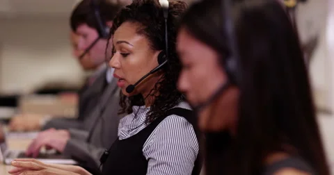 4k, Angry frustrated call centre executive talking on the phone with a headset. Video stock 61554019