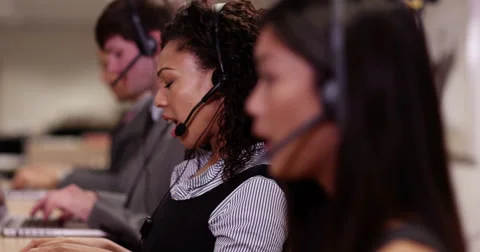 4k, Angry frustrated call centre executive talking on the phone with a headset. Stock Footage 61554528