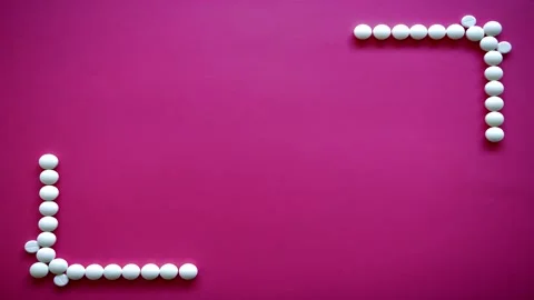 4K Animated corner frame made of pills on Viva Magenta  background,loop Stock Footage 157237430
