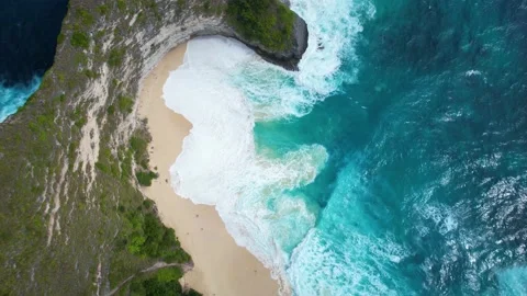 4K Arial View of white sand beach, green cliffs, and waves Stock Footage 202644907