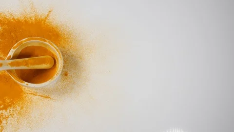 4k Aromatic Turmeric powder in mortar and pestle on white background pan herbs Stock Footage 88477144