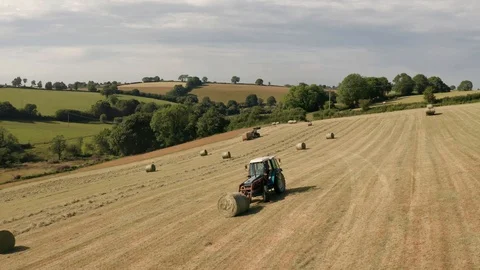 4K Ascending Pan Around Tractor in Rural Devon Stock Footage 112326470