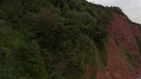 4k Ascending Shot Over Cliffs at Ness Cove, Shaldon on the South Devon Coast Stock Footage 113114621
