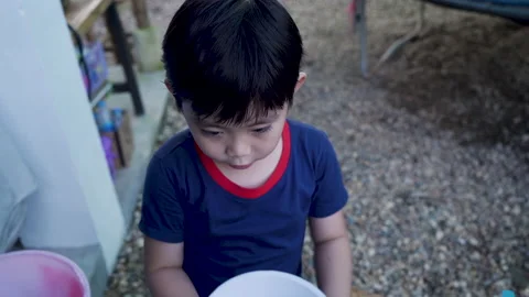4K, Asian boy close up, In public place with playground, UPC pipes are bein.. Vidéo 237374045