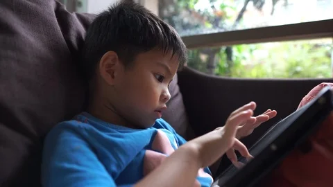 4K asian boy using tablet for educational learning. Stock Footage 104312209