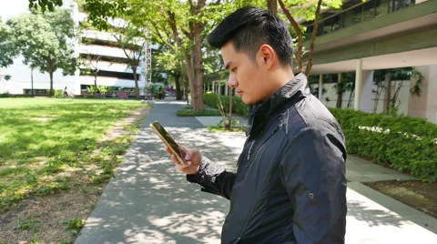 4k Asian Man using a smart phone. Stock Footage 61631637