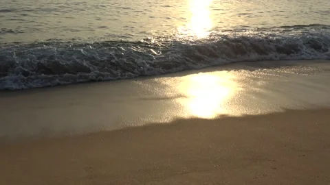 4K ASMR Golden Yellow Reflection on Dark Bronze Wet Shore and Khaki Grey Waves Stock Footage 340666226