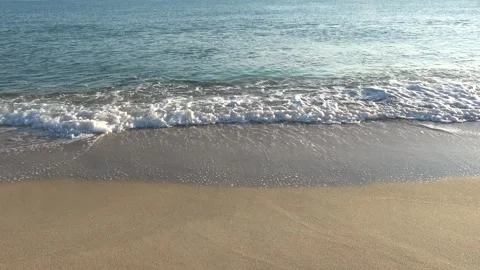 4K ASMR Grayish-Brown Wet Shore and Deep-Teal Sea Waves with Soft Silver Ripples Stock Footage 345687850