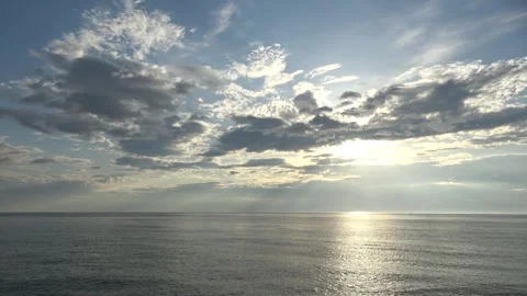 4K ASMR Ivory Light Rays under Charcoal Clouds over Silver Gray Ocean Vídeos de archivo 339108241