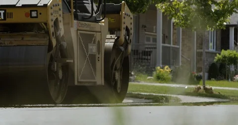4K asphalt machine paving Stock Footage 112062219