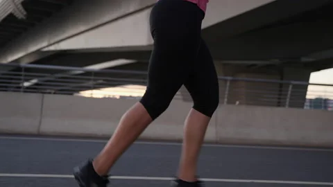 4k Athletic woman runs on bridge in city outdoors spbas. Stock Footage 219641553