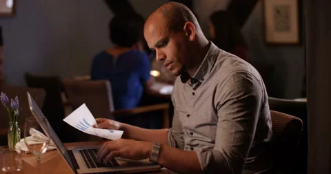 4k, An attractive businessman using laptop in a restaurant. Stock Footage 62915690
