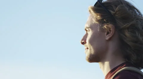4K Attractive man looking around and content with what he sees, in slow motion Stock Footage 64972921