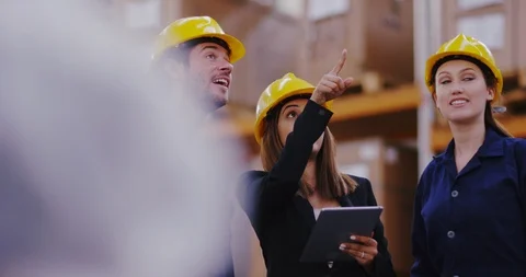 4K Attractive smiling team of workers having a meeting in industrial warehouse Stock Footage 101948336