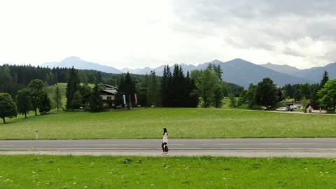 4K - Austrian doll walking through the mountains Stock Footage