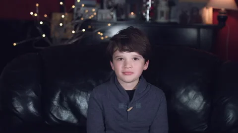 4k Authentic Shot of a Cheerful Child Posing on Couch Stock Footage