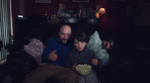 4k Authentic Shot of a Child watching Football with his Dad 스톡 동영상 67855389