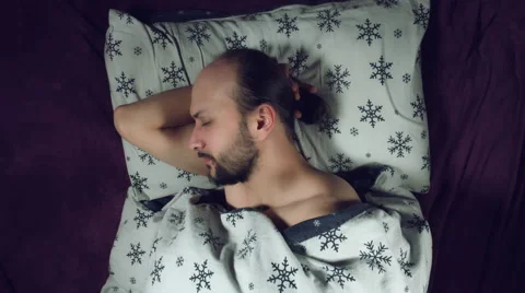 4k Authentic Shot of a Man in Bed Sleeping Stock Footage