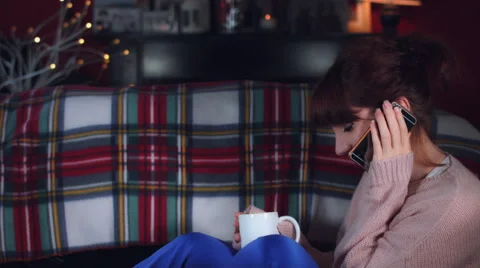 4k Authentic Shot of a Woman Talking on Phone with Tea Stock Footage