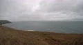 4K autumn scenic view dry grass sea cloudy day dark blue sea with waves 4k or 4k+ Resolution