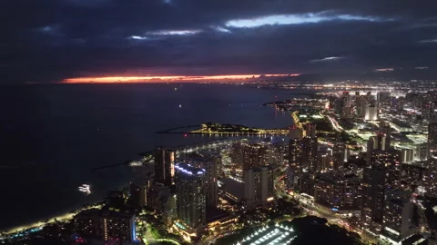 4K b-roll drone shot night scene, Illuminated night city on Oahu Hawaii island 스톡 동영상 242727500