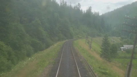 4K Back view of railroad train Mountain landscapes through the old retro train Stock Footage 119774518