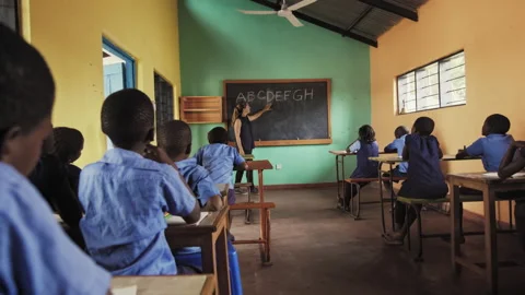 4k back view of school classroom of African students learning english language a Stock Footage 199624919