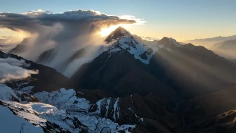 4K Backlit Snow Capped Peak Tocllaraju Sunrise Lenticular Clouds Peru Stock-Footage 334453122