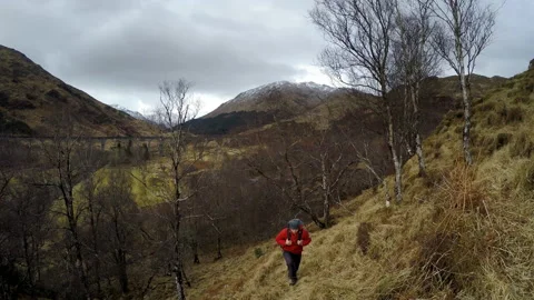 4K Backpacker exploring the hills near the famous Glenfinnan  Stock-Footage 164318719