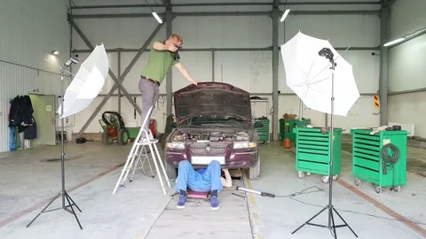  4K. Backstage photographing process of repair car team. Video stock 75463493