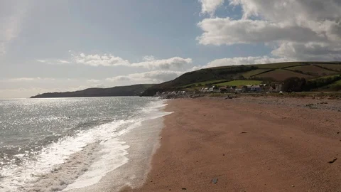 4K Backwards Flight Along Beach on the South Devon Coast Stock Footage 117054215