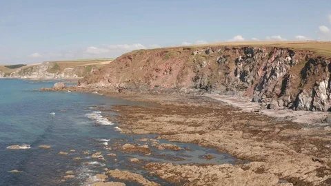4K Backwards Flight Past Cliffs on the South Devon Coast Stock Footage 112449059