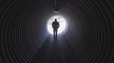 4k bald guy walks through tunnel Stock Footage 63125702