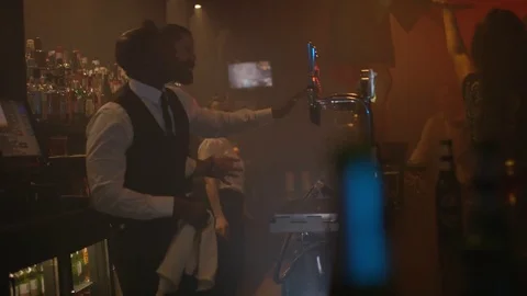 4K Bar Staff &amp; Customers Dancing &amp; Enjoying The Atmosphere In Lively Nightclub Stock Footage 75790931