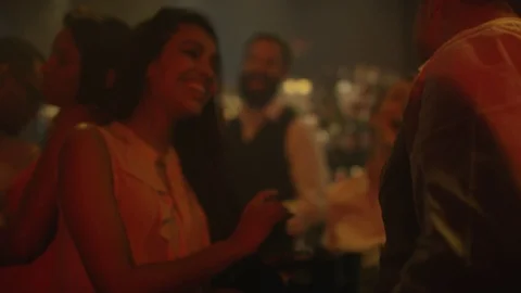 4K Bar Staff Serving Drinks &amp; Chatting To Customers In Busy City Bar. Stock Footage 75794675