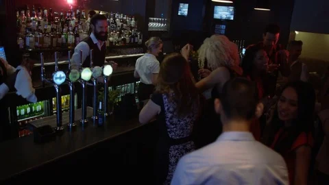 4K Bar Staff Working &amp; Young Party Crowd Dancing In Nightclub Stock Footage 75650489