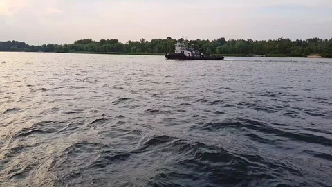 4K. Barge sails on the wide river of the Dnieper before the sunset Stock Footage 112949379