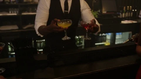 4K Barman Serving Drinks To Happy Young Party Crowd In Trendy City Bar Video stock 75620591