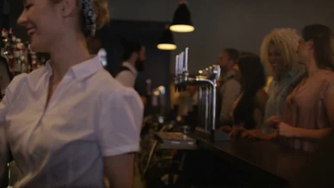 4K Bartender Pouring Shots For Group Of Friends Partying In City Bar Stock Footage 75738406
