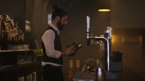 4K Bartender Wiping Down The Bar &amp; Setting Up Ready For Opening Time Stock Footage 75762696