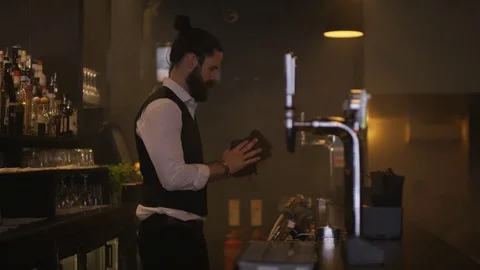 4K Bartender Wiping Down The Bar &amp; Setting Up Ready For Opening Time Stock Footage 75763143