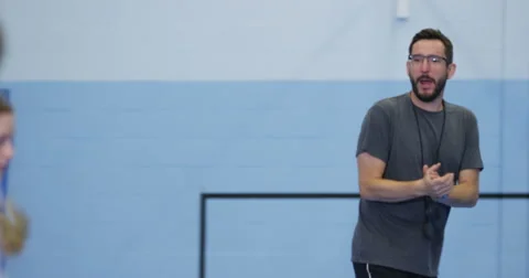 4k, Basketball team practicing with coach before a match at an indoor court. Stock Footage 68175285