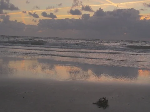 4k beach and ocean waves at dusk mith orange clouds (2) Video stock 75079718