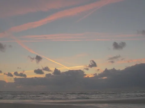 4k beach and ocean waves at dusk mith orange clouds (3) Video stock 75079974