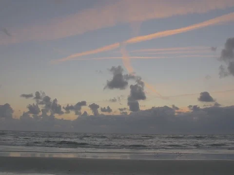 4k beach and ocean waves at dusk mith orange clouds (4) Video stock 75158790
