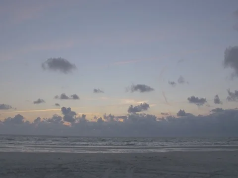 4k beach and ocean waves at dusk mith orange clouds (5) Video stock 75158802