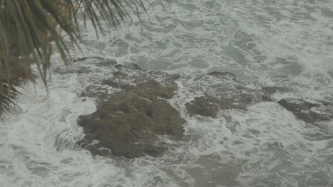 4K Beach Close Up Waves crashing into rocks Stock Footage 98897876