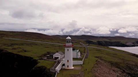 4K beautiful aerial view of an Irish lighthouse Stock Footage