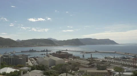 4k Beautiful Blue Water Ocean View Mountains In Background Naval Dockyard Ships Stock Footage