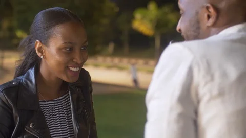 4k beautiful couple using cell phone outside the coffee shop at the night. Stock Footage 111334902
